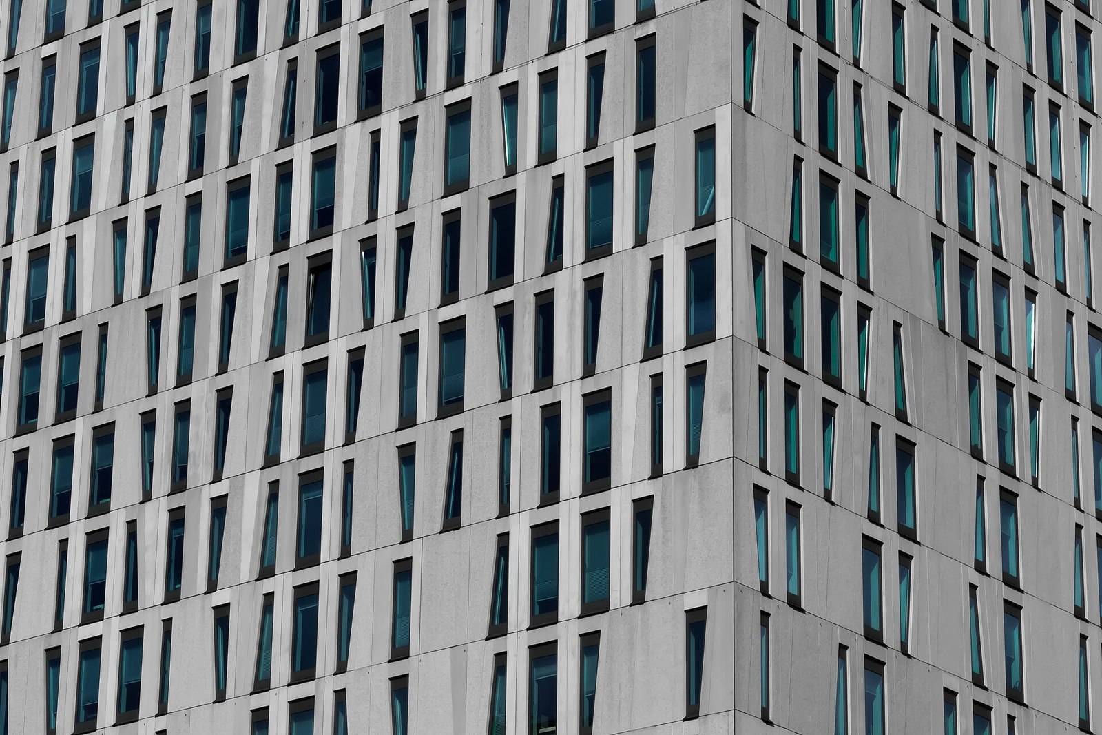 Grid of windows on a gray office facade